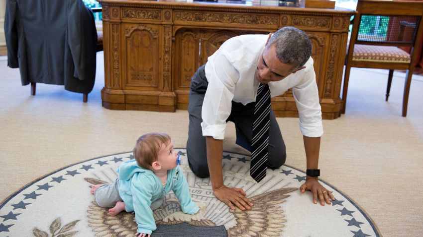"The President is always asking staff to bring their babies and young kids by for a visit. Here, during a break between meetings one afternoon, the President crawled around in the Oval Office with Communications Director Jen Psaki's daughter Vivi." (Official White House Photo by Pete Souza)