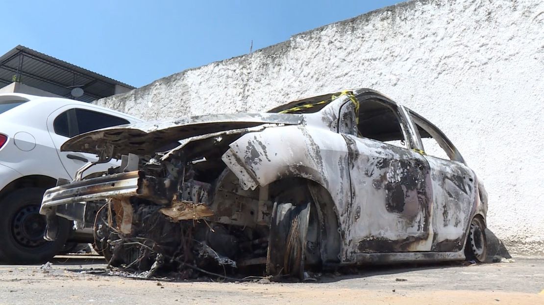 AFP video shows the burned-out rental car of missing Greek ambassador to Brazil Kyriakos Amiridis at a parking lot outside a police station. 