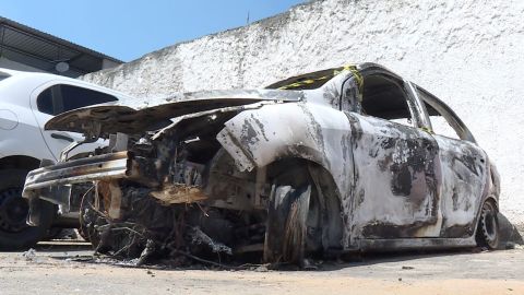 AFP video shows the burned-out rental car of missing Greek ambassador to Brazil Kyriakos Amiridis at a parking lot outside a police station.