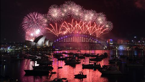 Fireworks illuminate the sky over the Opera House and Harbour Bridge in Sydney, Australia. 