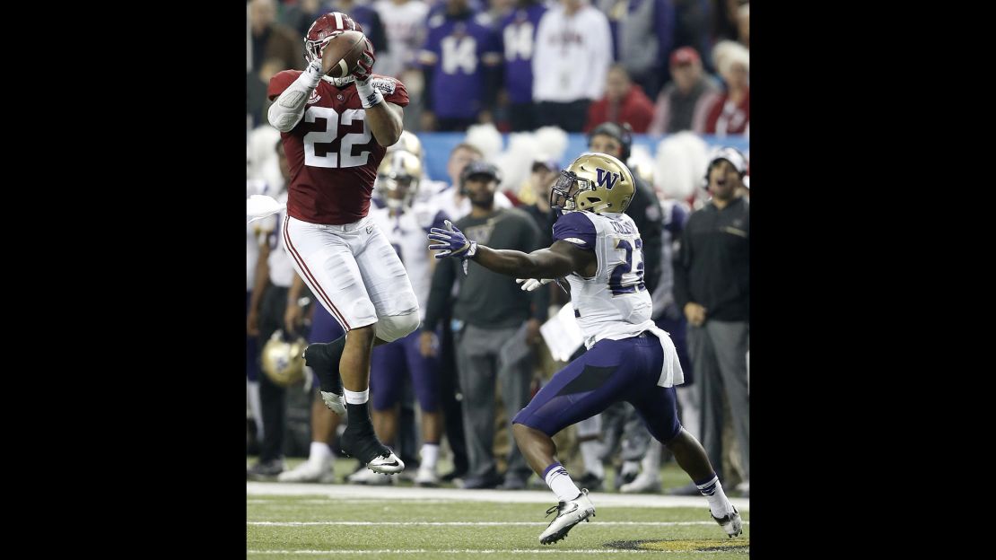 Alabama linebacker Ryan Anderson would score after picking off this pass intended for Washington running back Lavon Coleman.