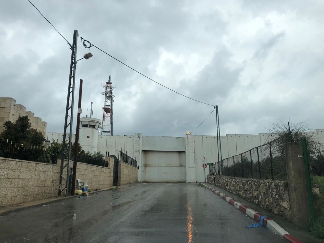 The imposing metal gate at Checkpoint 300, the main crossing point between Bethlehem and Jerusalem, is locked shut.