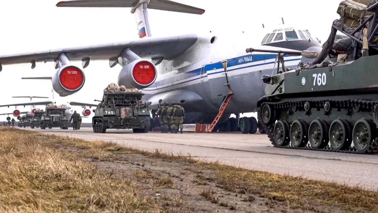 Russian military vehicles prepare to be loaded into a plane for airborne drills during maneuvers in Crimea.