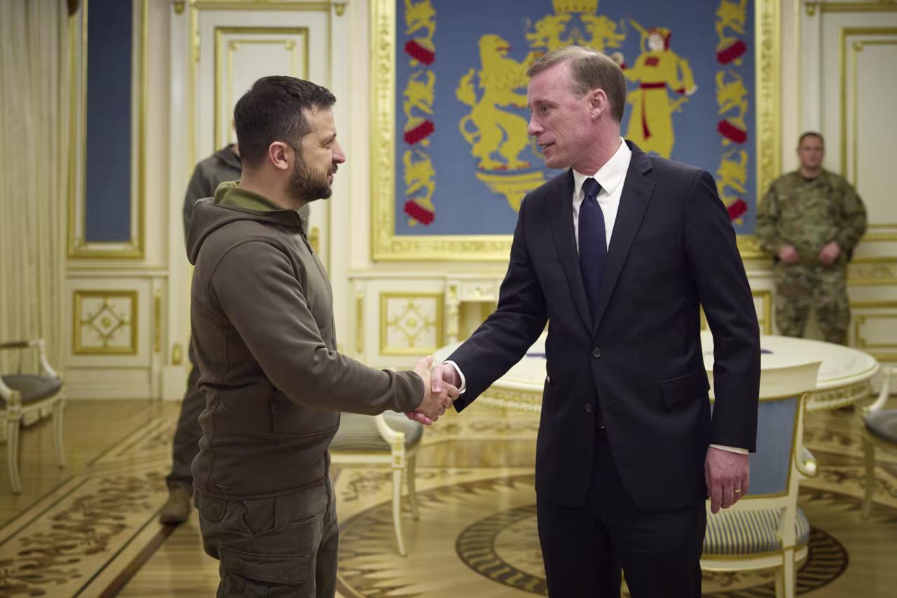Ukrainian President Volodymyr Zelensky grets National Security Adviser Jake Sullivan in Kyiv, Ukraine on Friday.