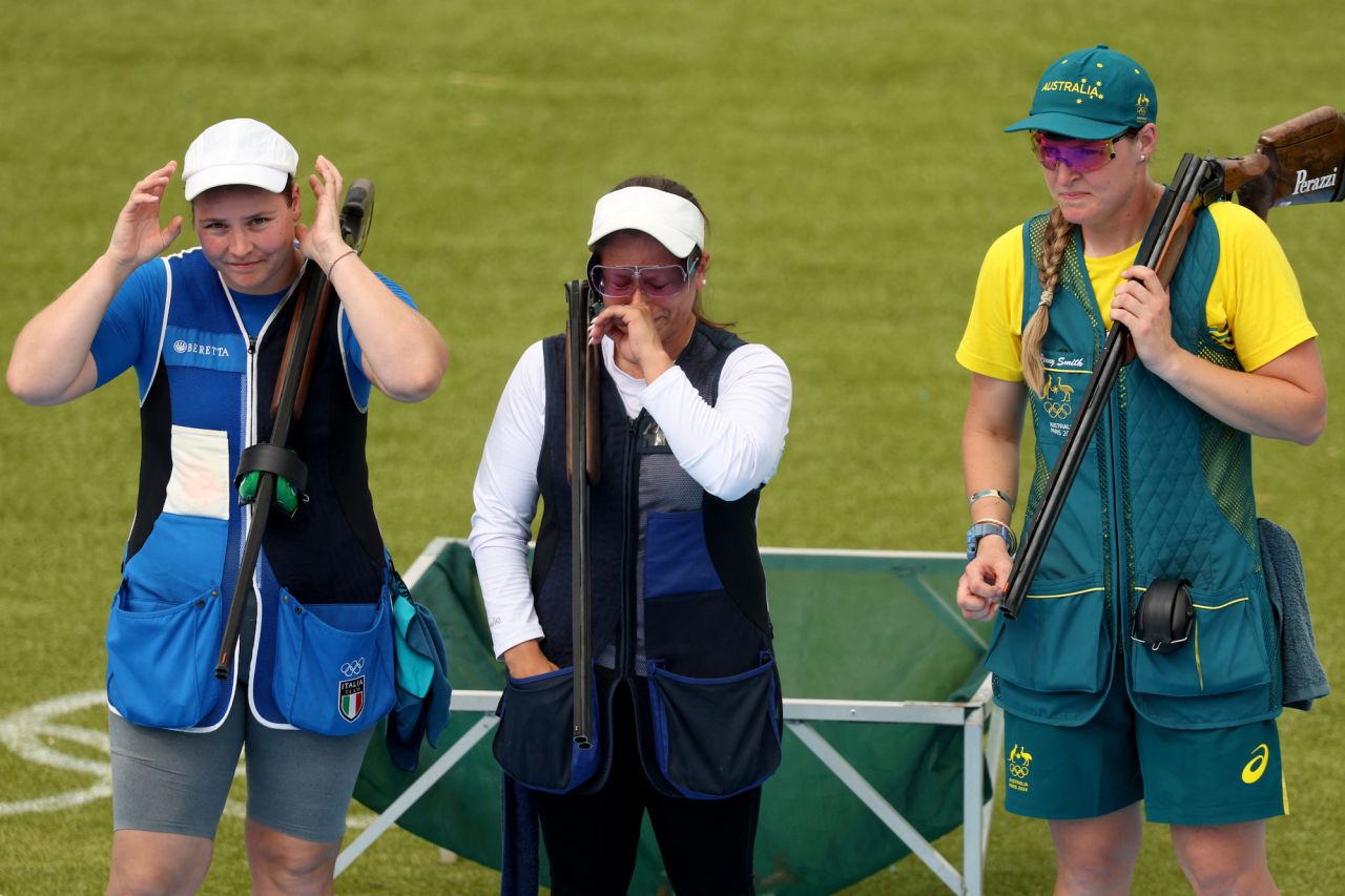 Guatemala's Adriana Ruano, center, reacts after winning gold at Chateauroux Shooting Centre on Tuesday.