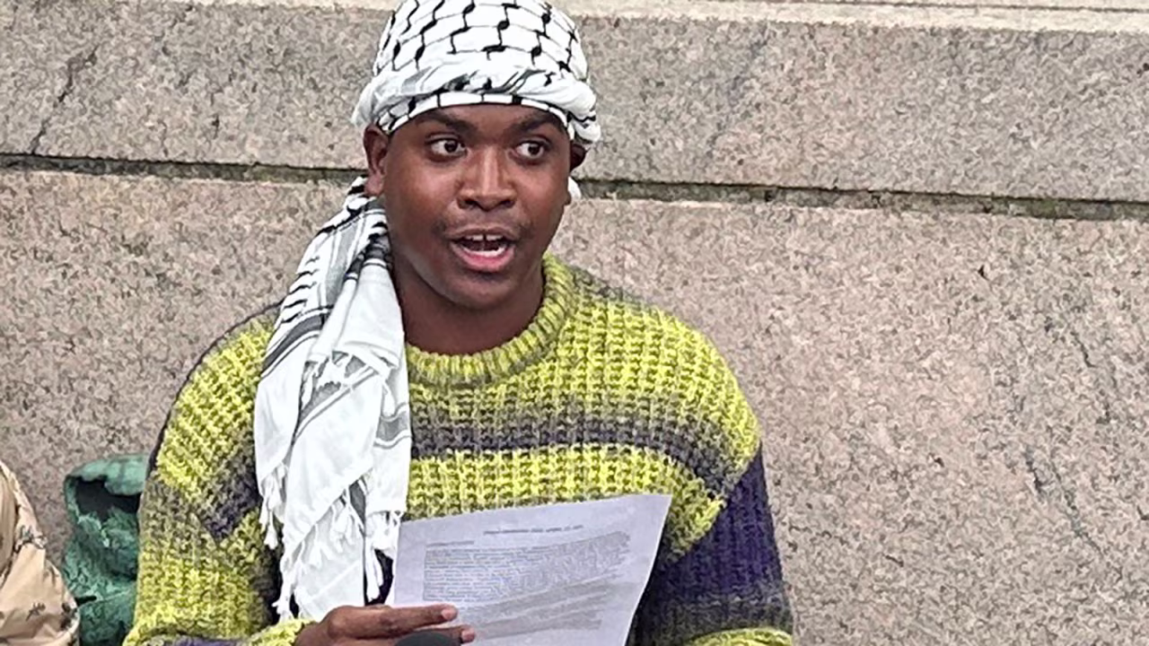 Demonstration leader Khymani James address the media outside a tent camp on the campus of Columbia University in New York on Wednesday, April 24.