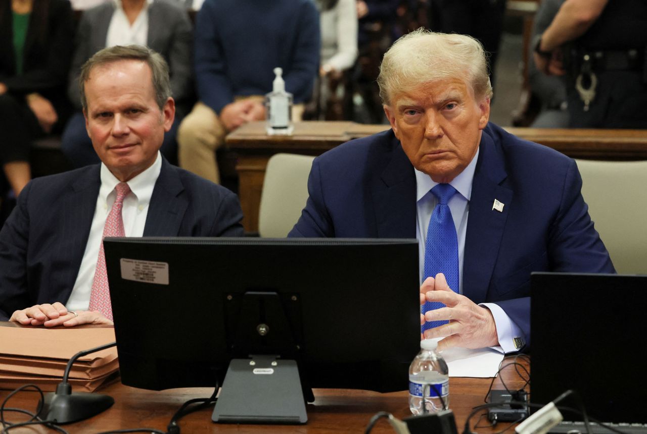 Former President Donald Trump and his lawyer Christopher Kise pose for photos in court in New York in November.