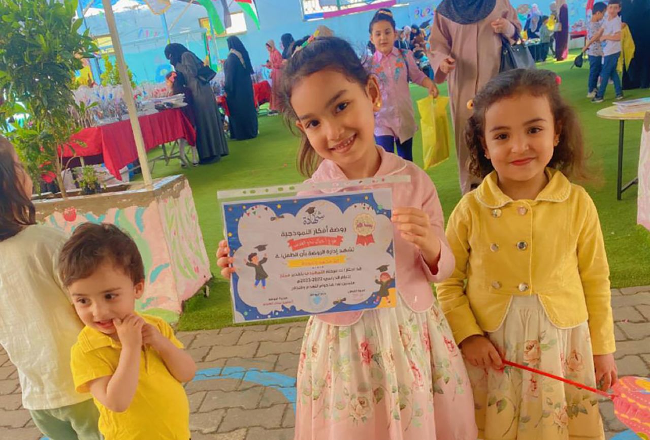 The Hamouda siblings, Kareem, 2, Ella, 6, and Sila, 4, at a pre-school graduation celebration June 15, 2023. 