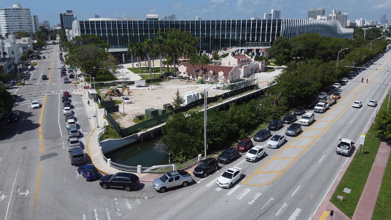 A long line of cars wait to enter a drive-through coronavirus testing site near the Miami Beach Convention Center on Thursday, June 25. 