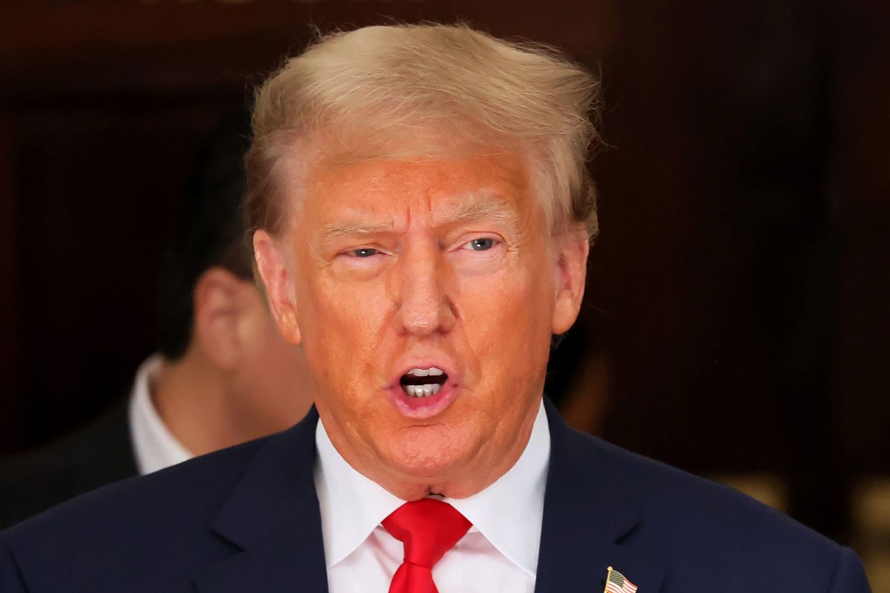 Former President Donald Trump speaks as he leaves the courtroom for a lunch recess on Tuesday.