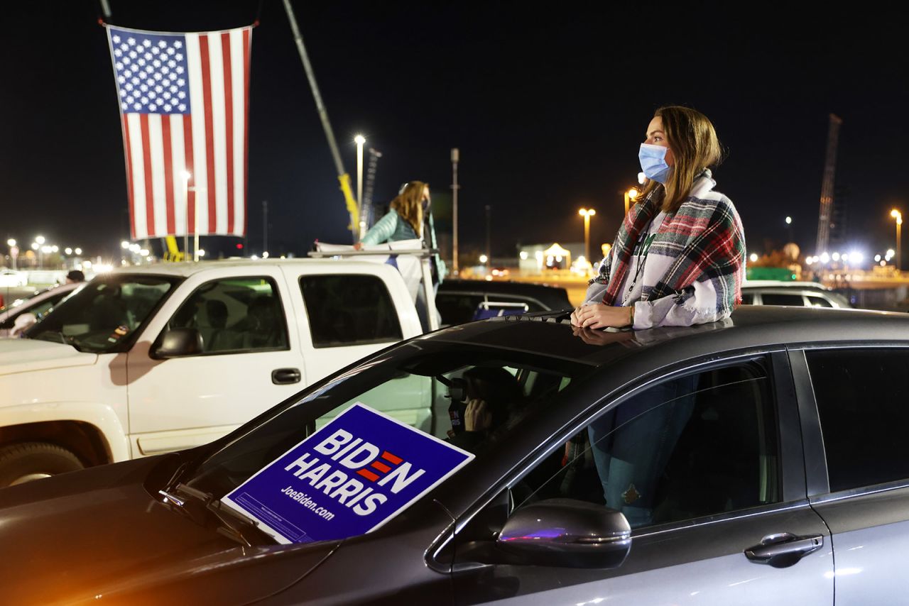 A supporter attends a drive-in election night event for Democratic presidential nominee Joe Biden at the Chase Center.