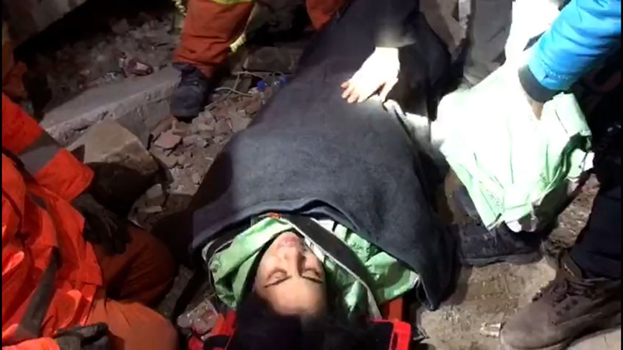 Fatma Demir?is seen talking with rescuers after being pulled from the collapsed building. 