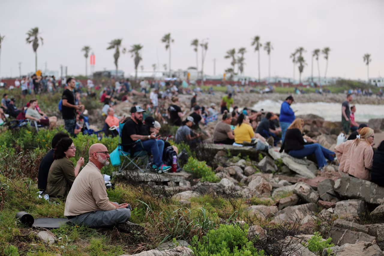 People wait before SpaceX's Starship spacecraft launch in Brownsville, Texas, on Thursday, April 20.