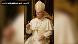 This AI-generated fake image shared by President Donald Trump to the social media platform Truth Social shows him depicted as the pope, wearing papal attire and a crucifix hanging around his neck while pointing with his index finger.