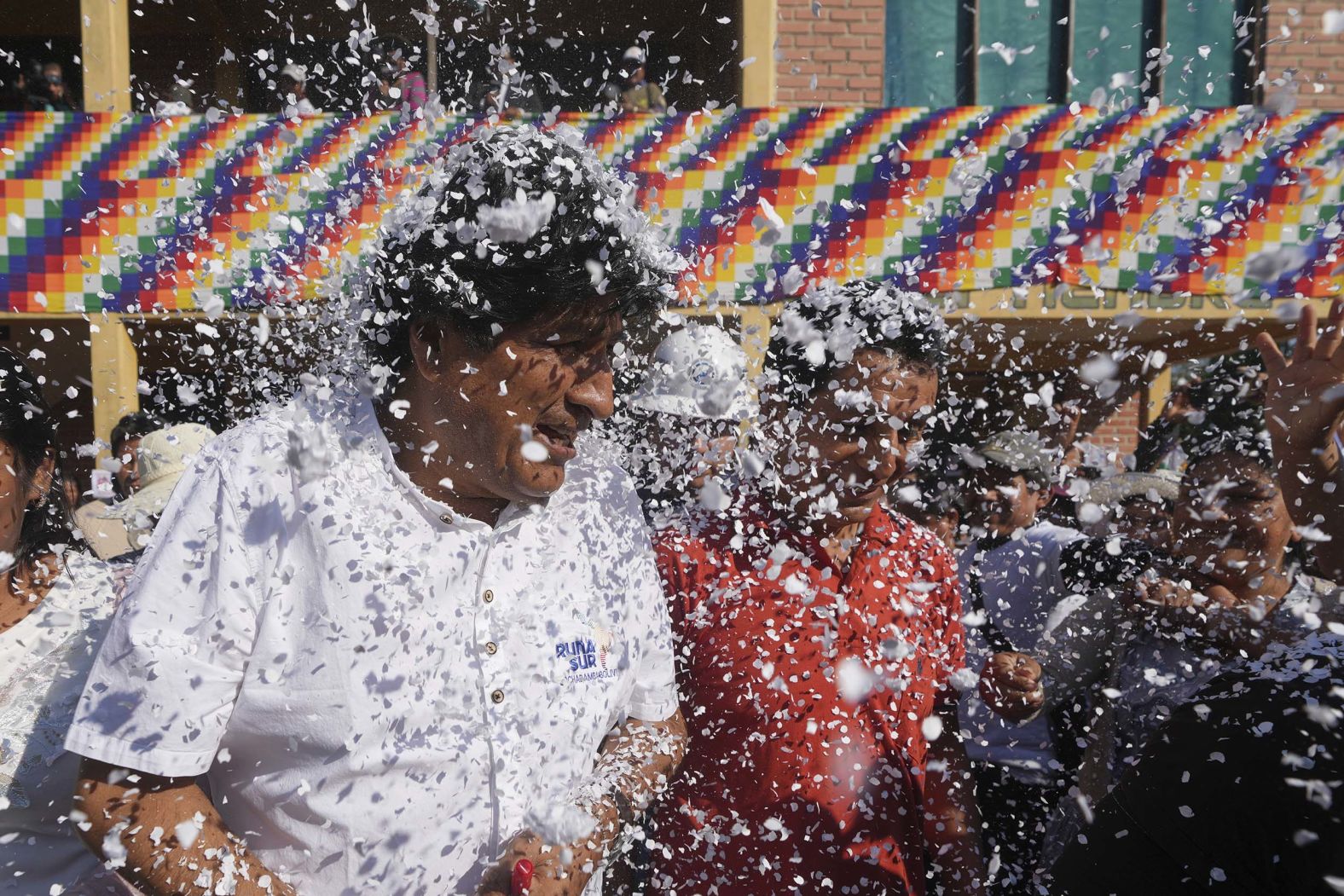 Supporters throw confetti on former President Evo Morales before he voted in presidential and legislative elections in the Chapare region of Bolivia on Sunday, August 17.