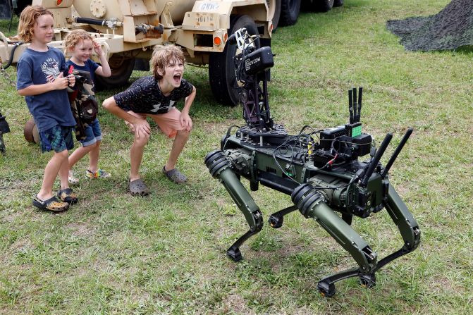 "Lone Wolf,” a military robotic dog, interacts with visitors at Fort Bragg, a US Army base in Fayetteville, North Carolina, on Tuesday, June 10. It was part of celebrations held for the Army’s 250th birthday.