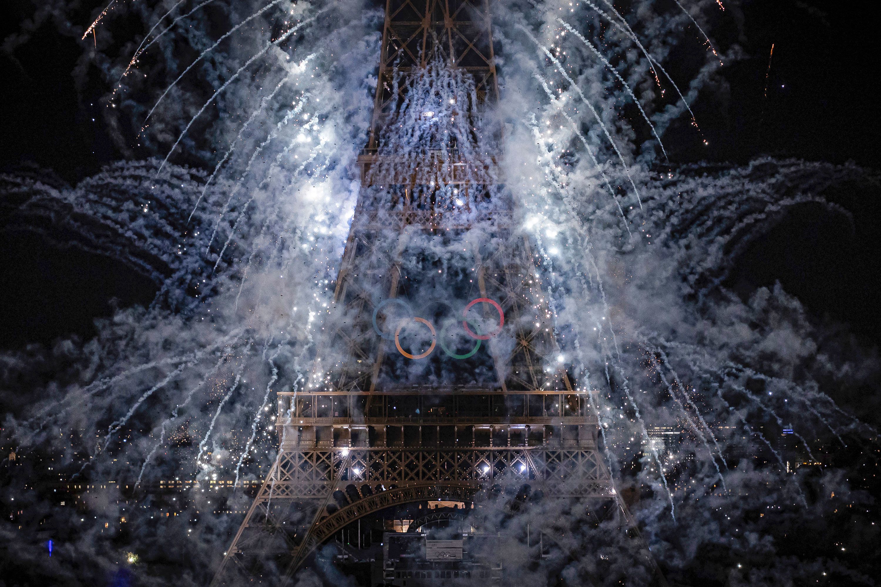 Fireworks illuminate the Eiffel Tower during Bastille Day celebrations in Paris on Sunday, July 14. Paris is hosting the Olympics later this month.