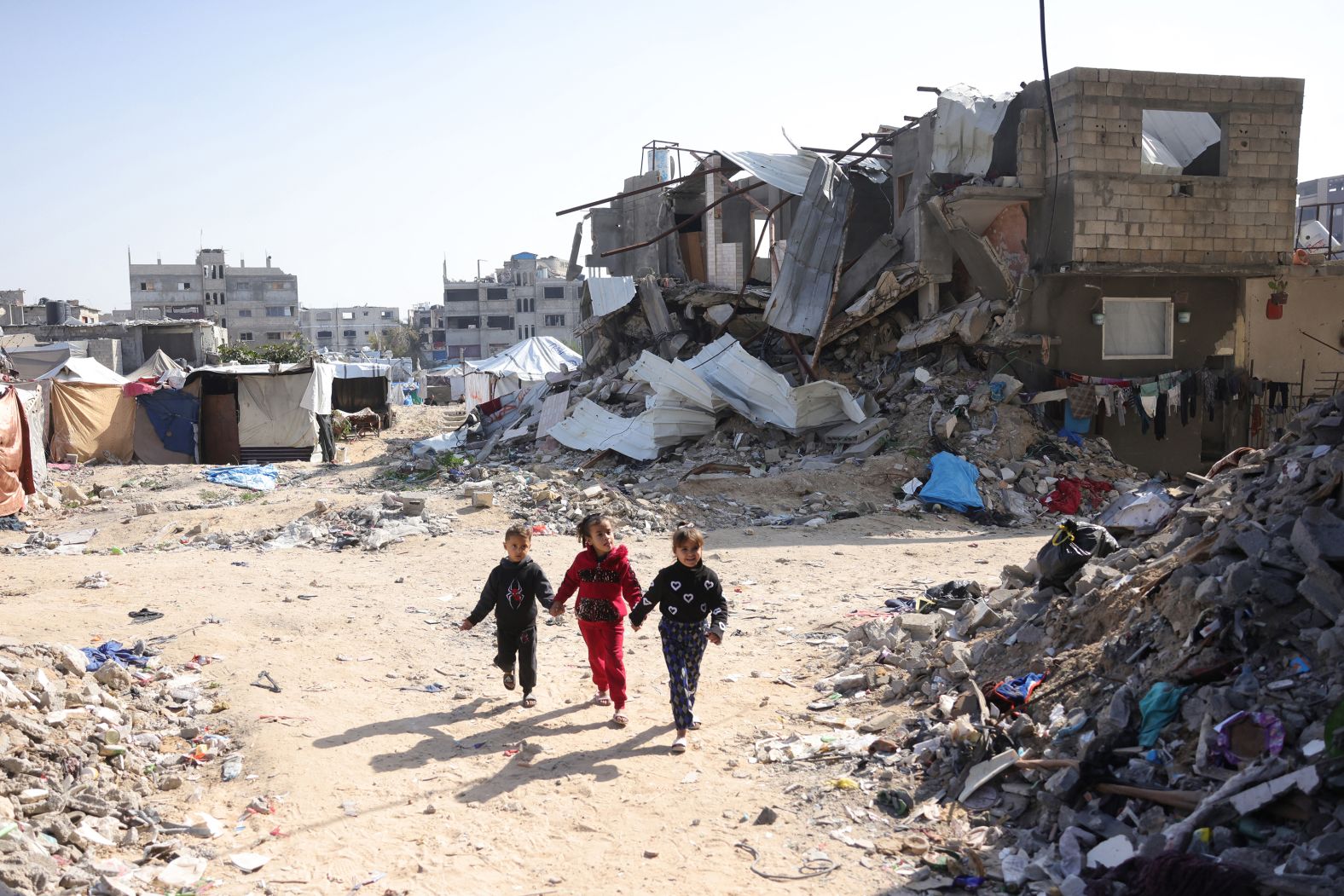 Palestinian children play amid rubble in Jabalya, Gaza, on Monday, February 17.