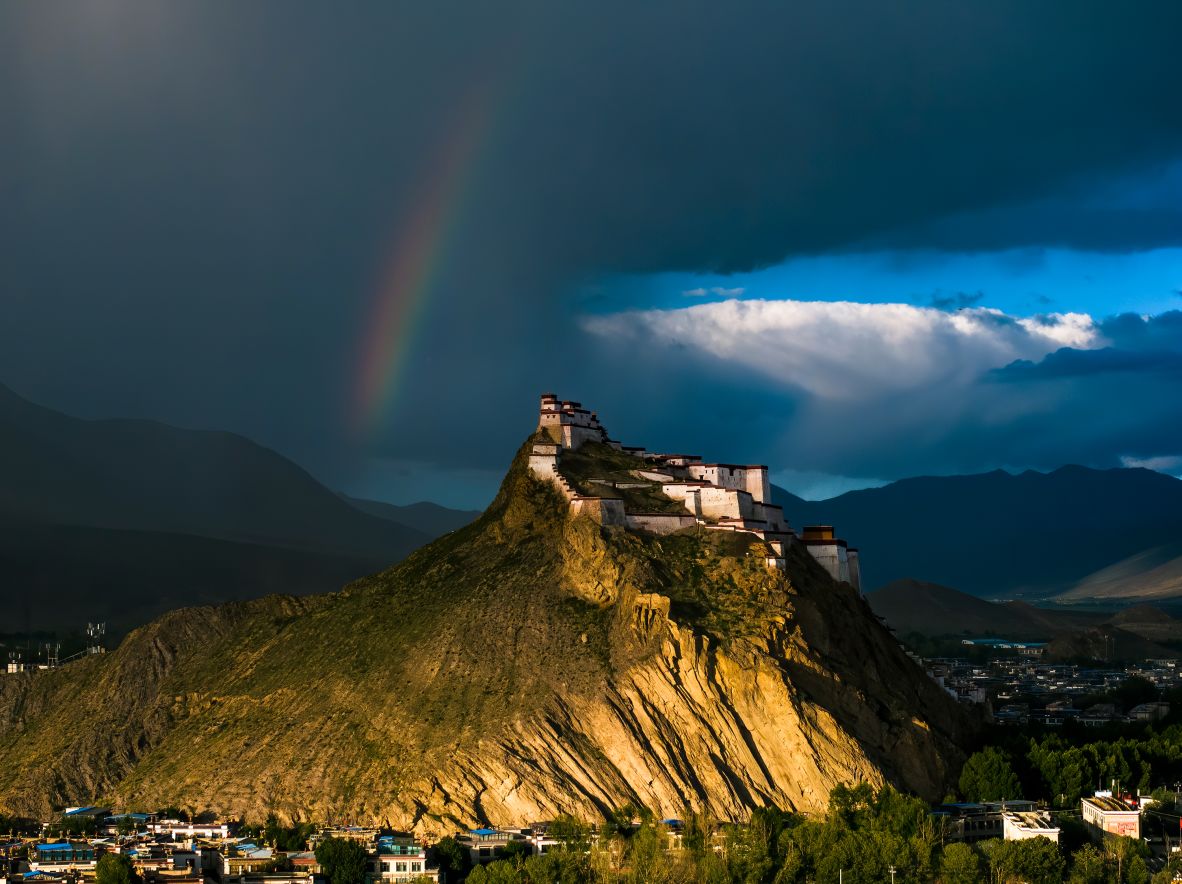 A rainbow appears over the Jiangzi Zongshan Castle in Shigatse, Tibet, on Wednesday, July 9.