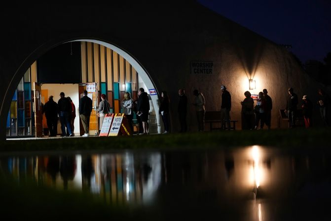 Voters stand in line outside a polling place in Phoenix on Tuesday morning.