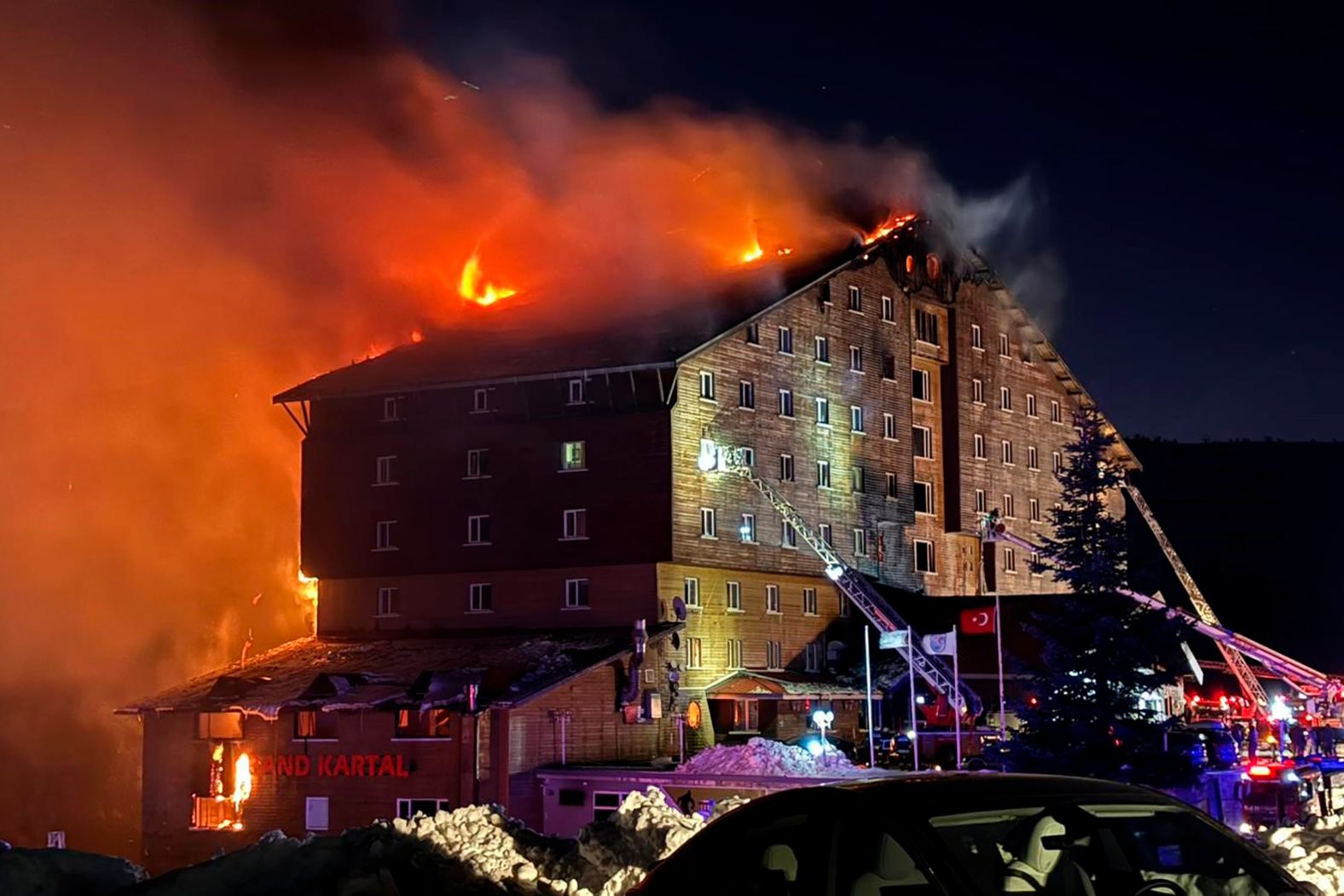 Firefighters work to extinguish <a href="index.php?page=&url=https%3A%2F%2Fwww.cnn.com%2F2025%2F01%2F21%2Feurope%2Fturkey-kartalkaya-hotel-fire-bolu-intl-hnk%2Findex.html">a fire at a ski resort hotel</a> in Kartalkaya, Turkey, on Tuesday, January 21. At least 79 people were killed in the early morning blaze, Turkish state news agency Anadolu reported, citing the prosecutor’s office in the Bolu province.