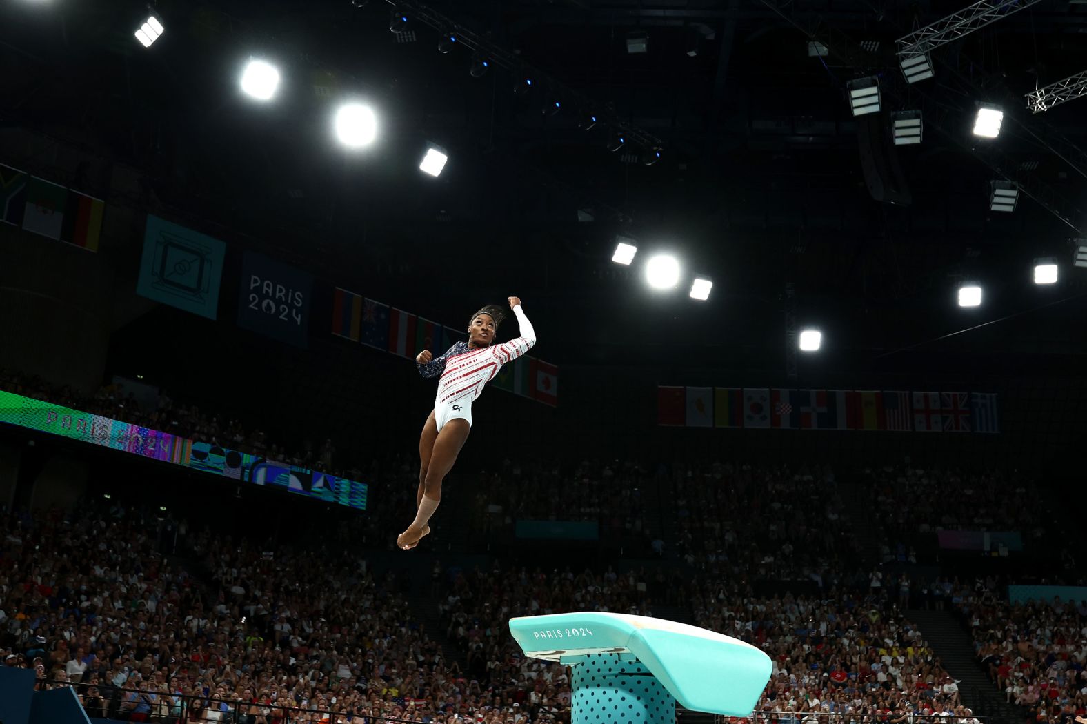 Biles twists through the air during her vault at the beginning of the competition. <a href="index.php?page=&url=https%3A%2F%2Fwww.cnn.com%2Fsport%2Flive-news%2Fparis-olympics-news-2024-07-30%23h_c3ac600093a8e4f8edb5281d23b80a3d">She scored an incredible 14.900</a> and stuck her landing with no sign of any pain in her left leg that was so closely watched.