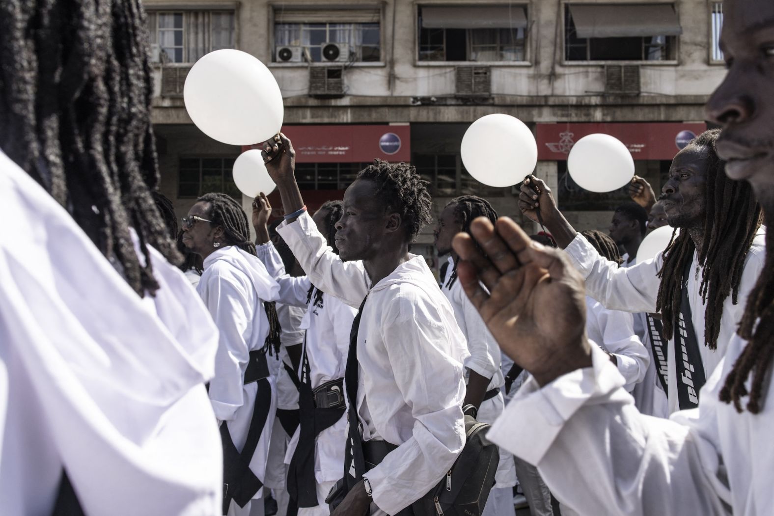 Followers of the late religious leader Amadou Bamba sing and march during celebrations in Dakar, Senegal, on Monday, November 11. Over a century ago, Bamba was exiled to Gabon for seven years for his opposition to French colonization. This march celebrated the anniversary of his return.