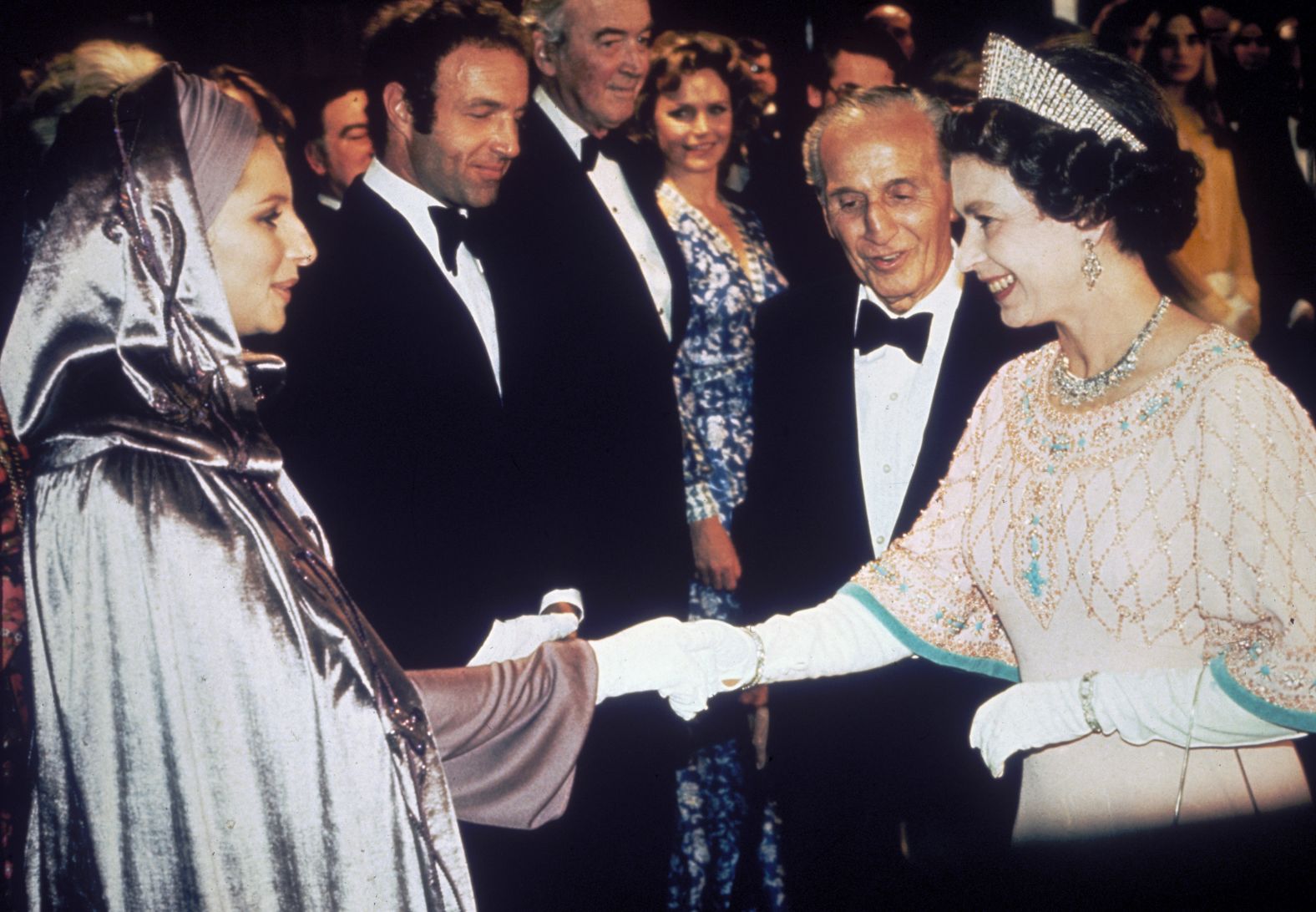 Britain's Queen Elizabeth II greets Streisand at the film premiere of "Funny Lady," the 1975 follow-up to "Funny Girl."