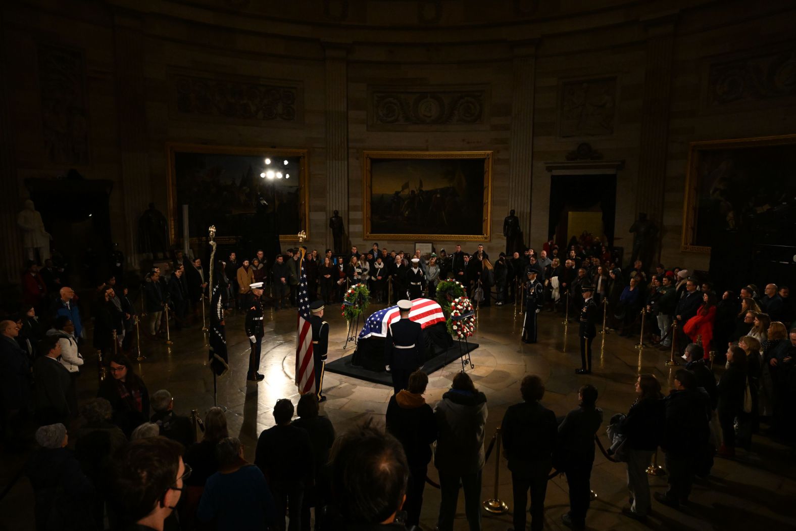 The casket of former US President Jimmy Carter is illuminated in the Capitol Rotunda on Tuesday, January 7. Carter was lying in state for a couple of days, allowing members of the public to say goodbye before his funeral.