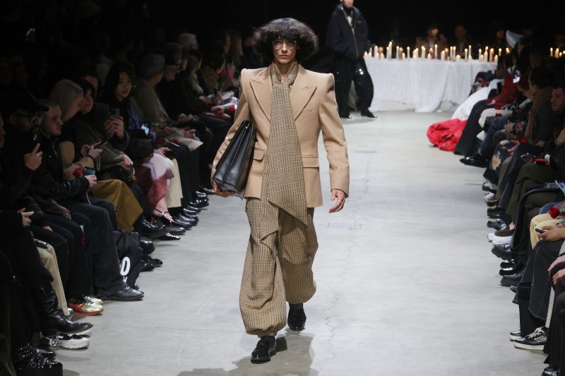 Wide lapels and wider shoulders played against bubble hemlines on the runway.