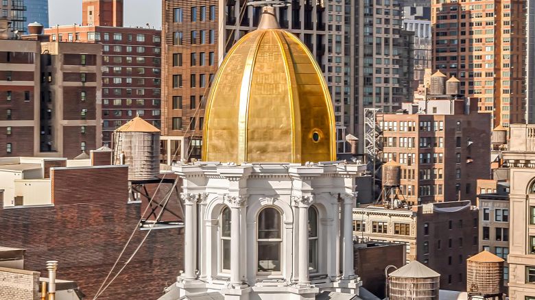 A rare penthouse inside a glimmering gold dome is up for sale in New York City.