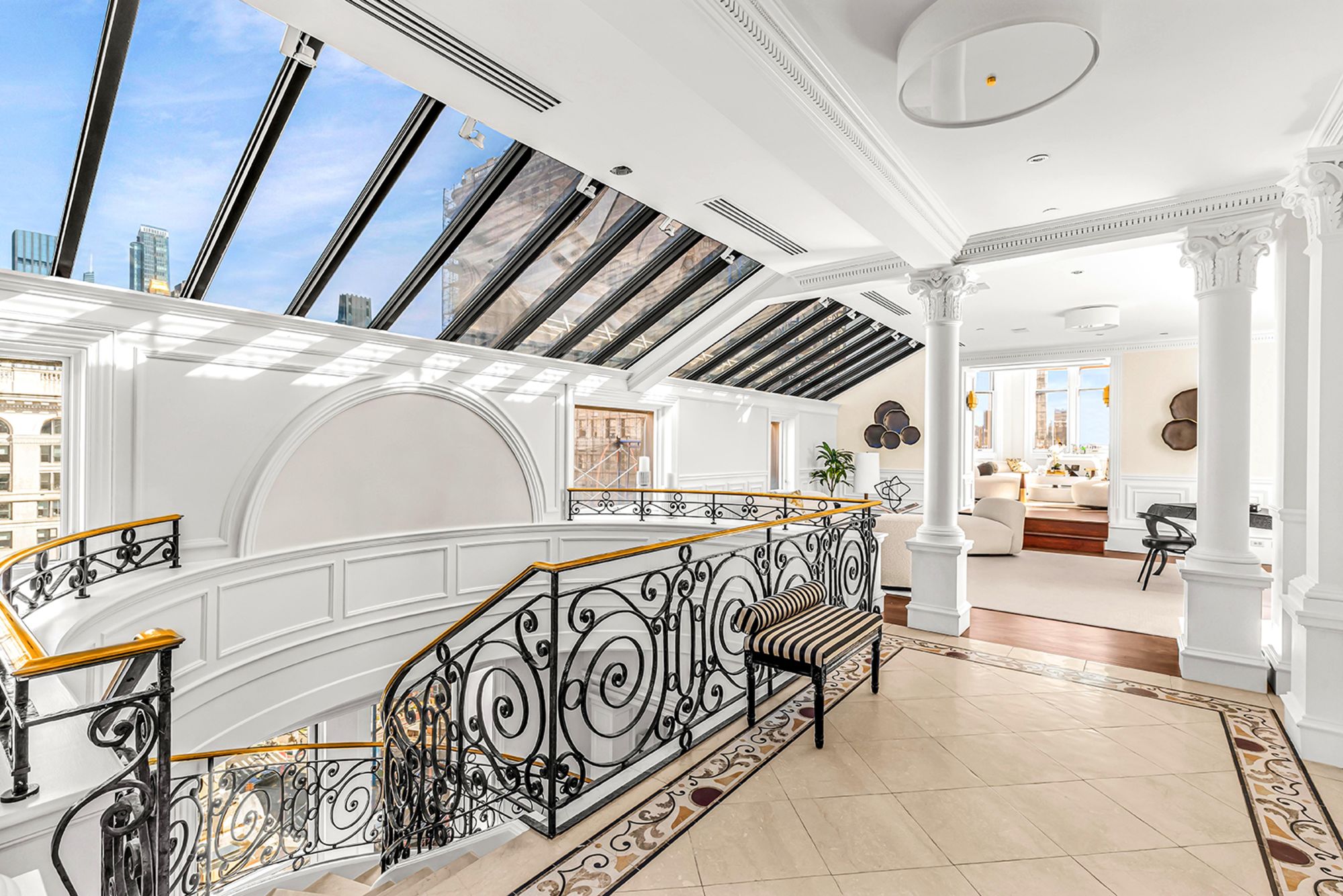 Inside the penthouse apartment of 170 Fifth Avenue, which includes rows of skylights and 360-degree views of Manhattan from a gold-crowned cupola.