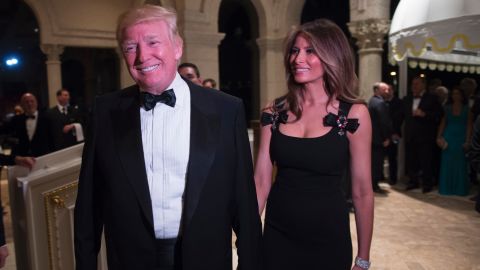 President-elect Donald Trump arrives with his wife, Melania, for a New Year's Eve party December 31, 2016 at Mar-a-Lago in Palm Beach, Florida.