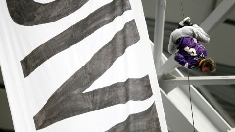One protester wore a Minnesota Vikings Brett Favre jersey as he dangled from the rafters.