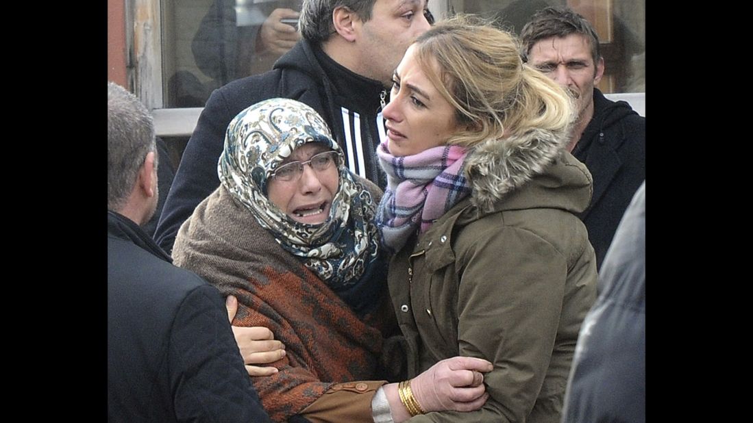 People mourn outside the Forensic Medical Center in Istanbul on January 1.