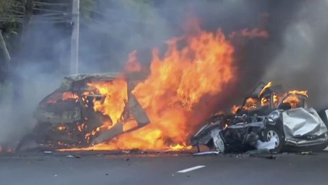Two vehicles burn after they collided on a highway east of Bangkok, Thailand, on January 2, 2017.
