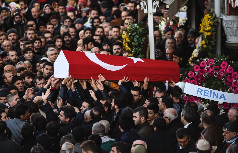 People carry the coffin of Yunus Gormek, a victim of the attack, during a funeral ceremony in Istanbul on January 2.