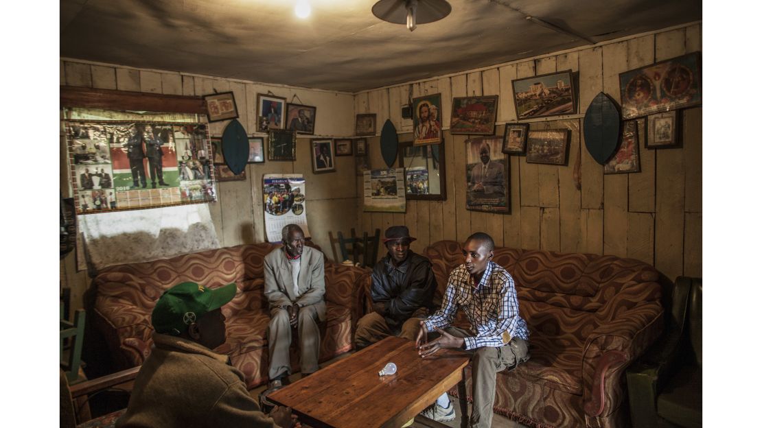 Muiruri talks with his grandfather and uncles. The family "had to defend and protect Ryan from the community."
