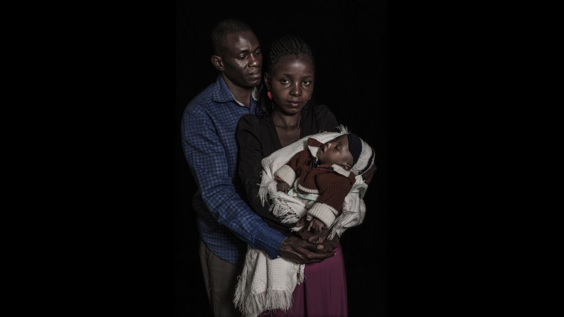 Maryann, 24, and Anthony Mwaura, 42, hold their one-year-old child who has an intersex condition as well as spinal problems. The couple says they are working to raise around US$300 to pay for a chromosomal test which they hope will determine his condition and identify a likely sex in which to raise their child.