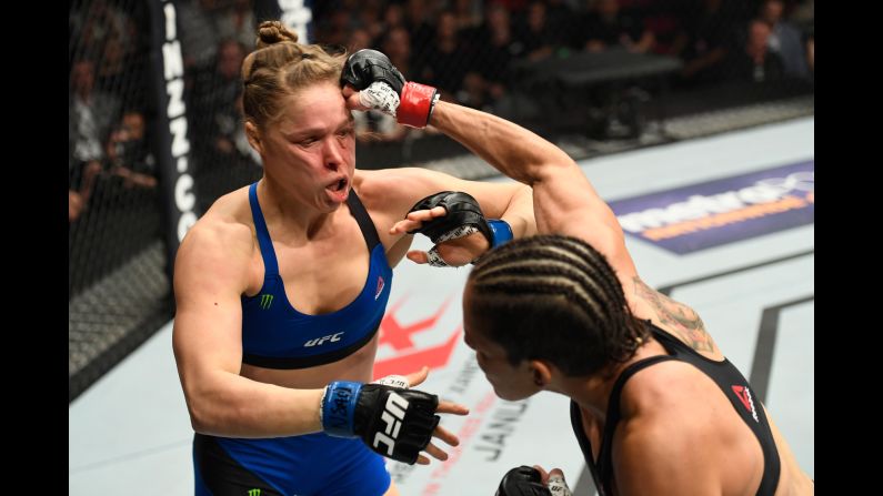 UFC bantamweight champion Amanda Nunes punches Ronda Rousey during their title fight in Las Vegas on Friday, December 30. <a href="index.php?page=&url=http%3A%2F%2Fwww.cnn.com%2F2016%2F12%2F31%2Fsport%2Fronda-rousey-amanda-nunes-ufc-207-ko%2Findex.html" target="_blank">Nunes demolished Rousey,</a> defeating the former champ in 48 seconds.