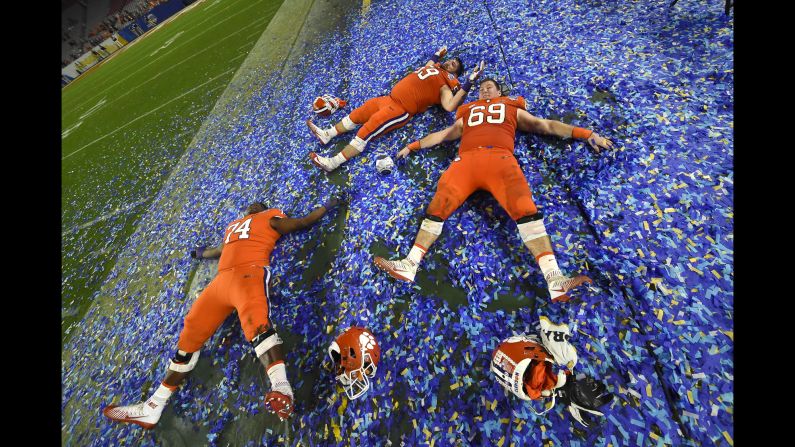 Clemson offensive linemen -- from left, John Simpson, Gage Cervenka and Maverick Morris -- play in confetti after the Tigers won the Fiesta Bowl on Saturday, December 31. Clemson crushed Ohio State 31-0 in what was a semifinal of the College Football Playoff. The Tigers <a href="index.php?page=&url=http%3A%2F%2Fwww.cnn.com%2F2016%2F12%2F31%2Fsport%2Fcollege-football-playoff-peach-bowl-fiesta-bowl-semifinals%2Findex.html" target="_blank">will face Alabama</a> in the championship game -- a rematch of <a href="index.php?page=&url=http%3A%2F%2Fwww.cnn.com%2F2016%2F01%2F11%2Fus%2Fncaa-football-national-championship%2F" target="_blank">last year's finale,</a> which Alabama won 45-40.