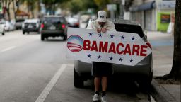 MIAMI, FL - FEBRUARY 05: Pedro Rojas holds a sign directing people to an insurance company where they can sign up for the Affordable Care Act, also known as Obamacare, before the February 15th deadline on February 5, 2015 in Miami, Florida. Numbers released by the government show that the Miami-Fort Lauderdale-West Palm Beach metropolitan area has signed up 637,514 consumers so far since open enrollment began on Nov. 15, which is more than twice as many as the next large metropolitan area, Atlanta, Georgia.