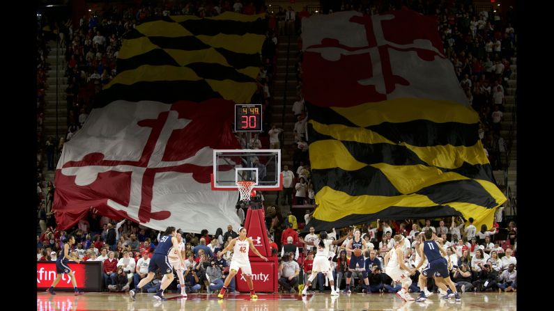 A giant Maryland flag is waved by fans during a college basketball game at the University of Maryland on Thursday, December 29.