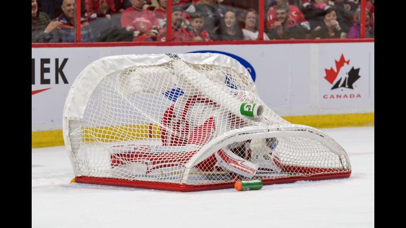 Detroit goalie Jared Coreau is covered by his own net after it was knocked over during an NHL game in Ottawa on Thursday, December 29.