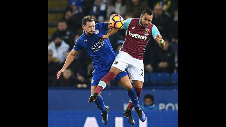 Leicester City's Danny Drinkwater, left, collides with West Ham's Dimitri Payet during a Premier League match in Leicester, England, on Saturday, December 31.