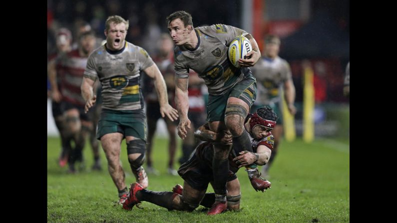 Gloucester Rugby's Lewis Ludlow tries to tackle Northampton's Louis Picamoles during a Premiership match in Gloucester, England, on Sunday, January 1.