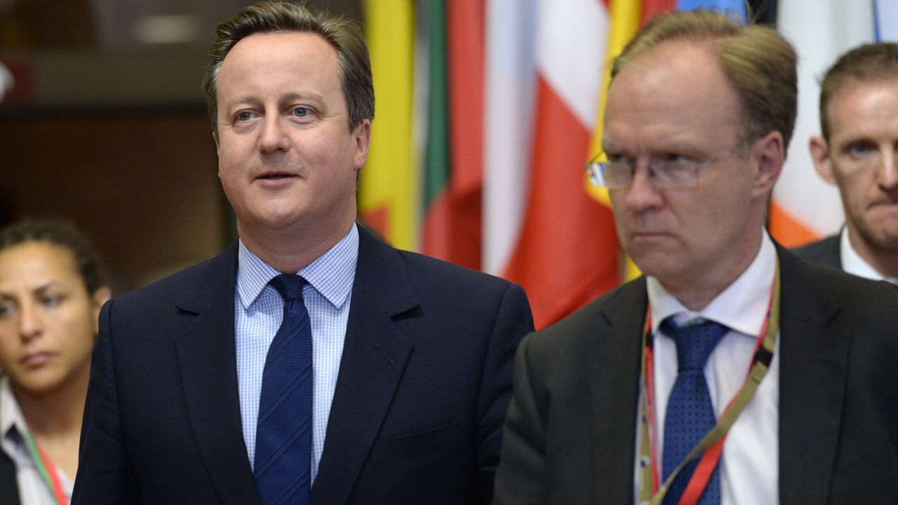 Britain's ambassador to the European Union, Ivan Rogers, walks along side than British Prime Minister David Cameron after the first day of an EU - Summit at the EU headquarters in Brussels on June 28, 2016.
