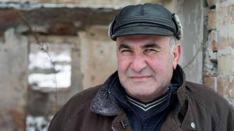 Merab Mekarishvili says he had to choose between his family home and his land when the border shifted around it.