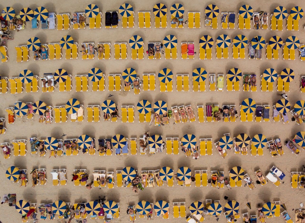 <strong>Summer camp: </strong>Umbrellas and beach-goers reduced to miniature make this picture of Playa de Amadores, Gran Canaria, one of the top 20 drone photos of 2016.