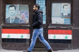 Posters of Syrian President Bashar al-Assad are seen in front of shop front's in Damascus on January 3rd.